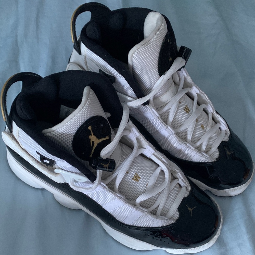 Nike Air Jordans Boys Black and White Sneakers with Gold Accents